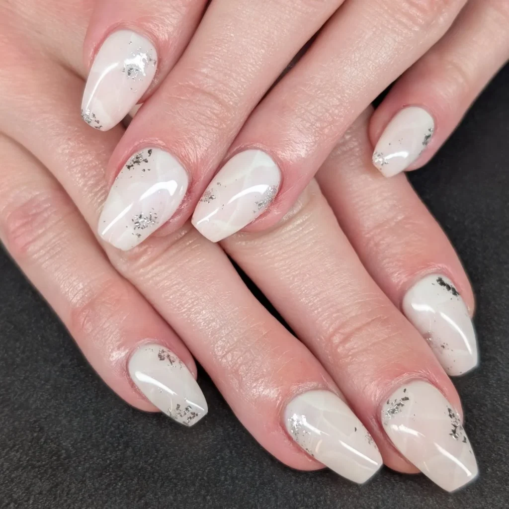 Milky White Nails with Silver Flake Accents