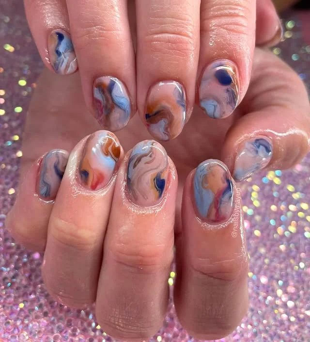 Abstract Marble Nails in Blue and Earthy Tones