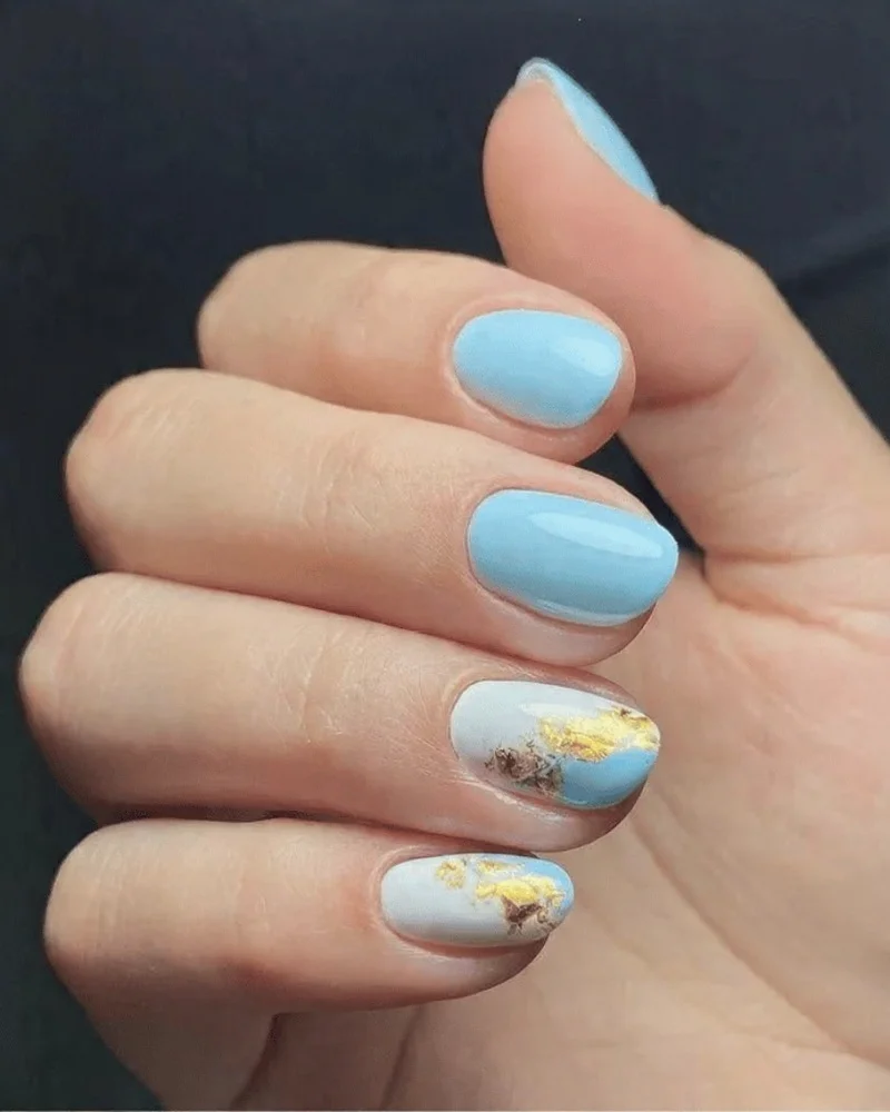 Elegant Light Blue Nails with Gold Accents