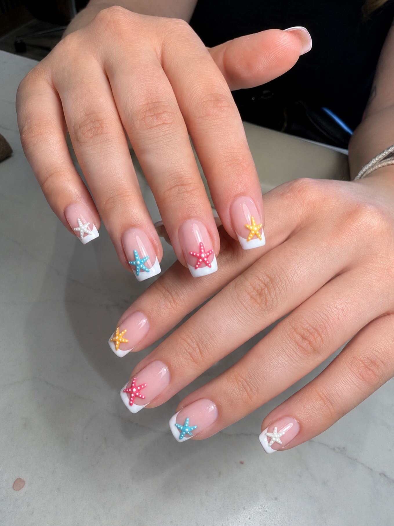 White French Tips with Rainbow Starfish Charms